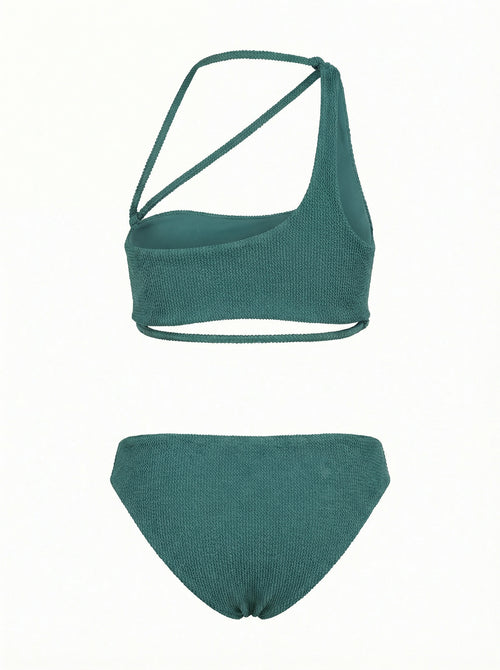 green bikini set with a wrap-design top and bikini bottom on a white background